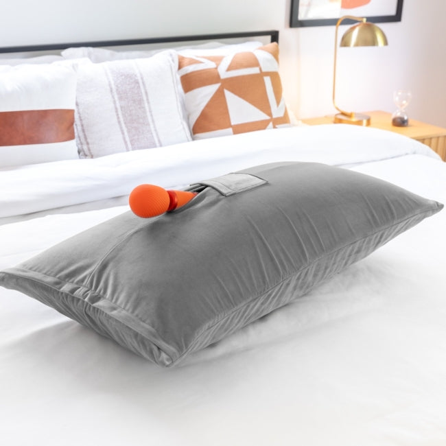 grey liberator supportive pillow with a orange wand sex toy