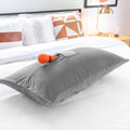 grey liberator supportive pillow with a orange wand sex toy