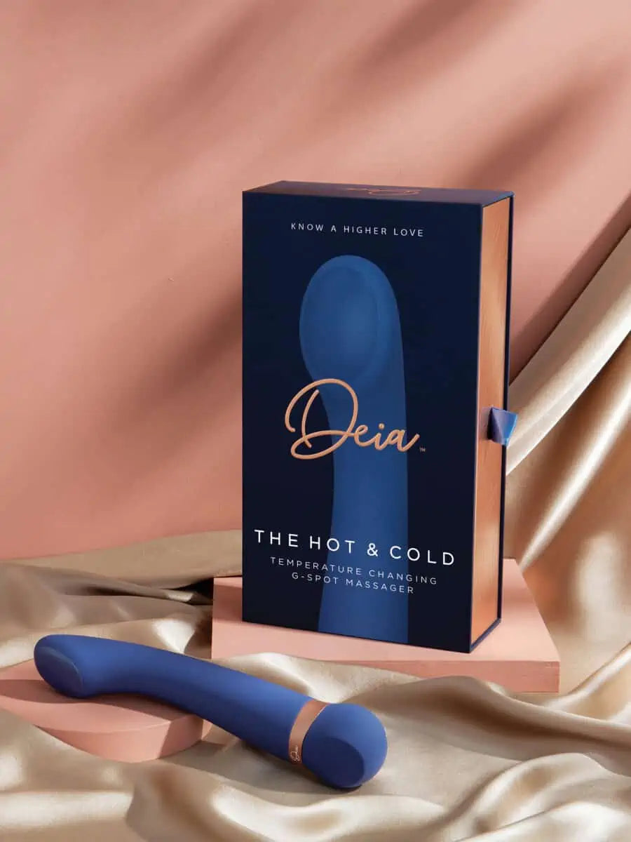 The Hot and Cold - Deia - Blue silicone Deia Hot and Cold vibrator with gold accent next to navy and gold branded ouiboutique box. - chaleur, point g, vibrateur