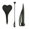 Cravache en forme de coeur en cuir 26 inch - Black 26-inch leather heart-shaped BDSM riding crop with textured handle and wrist strap, ouiboutique. - BDSM